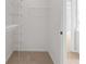 This walk-in closet is equipped with wire shelving for storage at 2620 Milford Ln, Alpharetta, GA 30009