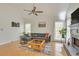 Relaxing living room with comfortable seating, fireplace, and bright windows at 3075 Superior Dr, Dacula, GA 30019