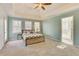 Tranquil main bedroom with carpet floors, natural light, and ensuite bathroom at 3075 Superior Dr, Dacula, GA 30019