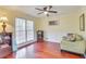 Inviting office space with hardwood floors, built-in shelving, and comfortable seating at 3075 Superior Dr, Dacula, GA 30019