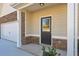 Inviting entrance with stone accents, a covered porch, and a well-lit walkway at 48 Beaver Pt, Villa Rica, GA 30180