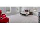 Bedroom featuring red accent chairs, bed, light walls, and soft carpet at 804 Trestle Creek Ct, Temple, GA 30179