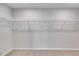 Empty closet featuring wire shelving, neutral walls, and carpet flooring at 804 Trestle Creek Ct, Temple, GA 30179