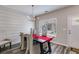 Bright dining room featuring wood floors, a modern chandelier, and a large window at 804 Trestle Creek Ct, Temple, GA 30179
