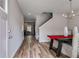 Entryway with wood floors, a dining table, and an adjacent staircase at 804 Trestle Creek Ct, Temple, GA 30179
