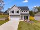 Charming two-story home features a two-car garage, a well-maintained lawn, and a welcoming front porch at 804 Trestle Creek Ct, Temple, GA 30179
