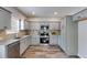 Modern kitchen featuring gray cabinets and stainless steel appliances at 804 Trestle Creek Ct, Temple, GA 30179