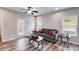 Cozy living room featuring wood floors, a ceiling fan, and access to the outdoors at 804 Trestle Creek Ct, Temple, GA 30179