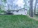This home features a spacious backyard with a deck, perfect for outdoor living and entertaining at 1090 Tanglewood Trl, Woodstock, GA 30189