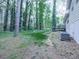 The backyard features a well-maintained lawn and mature trees and an upper deck at 1090 Tanglewood Trl, Woodstock, GA 30189