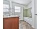This bathroom features a double vanity, a tub, and a window with blinds at 1090 Tanglewood Trl, Woodstock, GA 30189