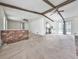Bright living room featuring exposed ceiling beams and an open layout to the dining space at 1090 Tanglewood Trl, Woodstock, GA 30189
