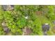 Aerial view of a home surrounded by lush green trees with the above ground pool visible at 1965 Midway Rd, Douglasville, GA 30135