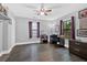 Bedroom featuring lots of natural light, hardwood floors, and a view from the large window at 1965 Midway Rd, Douglasville, GA 30135
