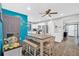 Bright dining area with a large table, a ceiling fan and hardwood floors at 1965 Midway Rd, Douglasville, GA 30135