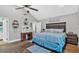 Spacious main bedroom with a vaulted ceiling, ceiling fan and dark wood furniture at 1965 Midway Rd, Douglasville, GA 30135