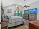 Spacious bedroom with a ceiling fan, backyard views, and stylish furniture at 1965 Midway Rd, Douglasville, GA 30135
