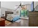 Beautiful bedroom featuring a decorative headboard, lots of natural light, and a scenic view at 1965 Midway Rd, Douglasville, GA 30135