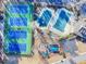 Aerial view of community amenities including tennis courts, swimming pools, and playground at 2112 Little River Dr, Suwanee, GA 30024