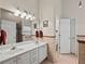 Spacious bathroom with double sinks, a large mirror, and tiled floors for a luxurious feel at 2112 Little River Dr, Suwanee, GA 30024