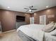 Serene primary bedroom featuring a king-size bed, ceiling fan, and ensuite bathroom at 2112 Little River Dr, Suwanee, GA 30024