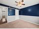 Charming bedroom with neutral carpeting, a ceiling fan, and ample closet space at 2112 Little River Dr, Suwanee, GA 30024