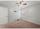 Clean bedroom featuring neutral paint, carpeting, ceiling fan and natural light at 2112 Little River Dr, Suwanee, GA 30024