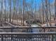 A stream view from the walking trail surrounded by nature at 2112 Little River Dr, Suwanee, GA 30024