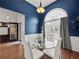 Beautiful dining room featuring a glass table, modern decor, and hardwood floors at 2112 Little River Dr, Suwanee, GA 30024