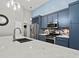 Modern kitchen with a large island, stainless steel appliances, and custom cabinetry at 2112 Little River Dr, Suwanee, GA 30024