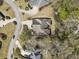 Overhead shot of a residential property highlighting its roof, lawn, driveway, and surrounding community, displaying location at 3290 Winthrop Ne Cir, Marietta, GA 30067