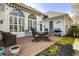 Backyard patio with outdoor seating and a well-maintained lawn and gas grill at 3290 Winthrop Ne Cir, Marietta, GA 30067