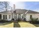 Backyard patio with outdoor seating and a well-maintained lawn plus a gas grill at 3290 Winthrop Ne Cir, Marietta, GA 30067