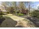 Expansive backyard showing manicured lawn, natural foliage, and thoughtful landscaping, perfect for outdoor activities and relaxation at 3290 Winthrop Ne Cir, Marietta, GA 30067