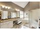 Bright bathroom with double vanity, separate shower, tub, and tiled floor at 3290 Winthrop Ne Cir, Marietta, GA 30067