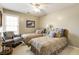 Bright bedroom features two twin beds, a striped chair and neutral walls at 3290 Winthrop Ne Cir, Marietta, GA 30067