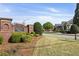Amberley Park brick entrance sign with manicured landscaping and a well-maintained neighborhood street view, creating a welcome at 3290 Winthrop Ne Cir, Marietta, GA 30067