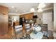 Open-concept dining area showcasing hardwood floors, kitchen access, and a stylish light fixture at 3290 Winthrop Ne Cir, Marietta, GA 30067