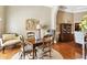 Cozy dining room with wood table, decorative lighting, and view of the kitchen at 3290 Winthrop Ne Cir, Marietta, GA 30067