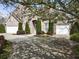 Traditional brick home with a three-car garage, mature landscaping, and an inviting front entrance, offering curb appeal at 3290 Winthrop Ne Cir, Marietta, GA 30067