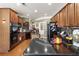 Well-equipped kitchen featuring dark countertops, wood cabinets, and modern appliances for culinary enthusiasts at 3290 Winthrop Ne Cir, Marietta, GA 30067