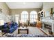 Inviting living room featuring vaulted ceilings, large windows, fireplace, and comfortable seating at 3290 Winthrop Ne Cir, Marietta, GA 30067
