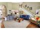 Spacious living room with staircase, hardwood floors, large windows, and elegant decor at 3290 Winthrop Ne Cir, Marietta, GA 30067