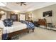 Large main bedroom with a tray ceiling, dark wood furniture, and carpeted floors at 3290 Winthrop Ne Cir, Marietta, GA 30067