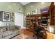 Comfortable home office features a wooden desk, shelving, and a plaid sofa at 3290 Winthrop Ne Cir, Marietta, GA 30067