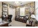Cozy office with ample wall art, a comfortable sofa, and functional desk space at 3290 Winthrop Ne Cir, Marietta, GA 30067