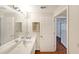 Bathroom with double sinks and door to the shower at 1800 Clairmont Lk # 427, Decatur, GA 30033