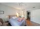 Well-lit bedroom with wood-look flooring, a ceiling fan and closet access at 1800 Clairmont Lk # A427, Decatur, GA 30033