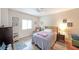 Comfortable bedroom with wood-look flooring, a ceiling fan, and natural light at 1800 Clairmont Lk # A427, Decatur, GA 30033