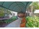 Apartment building entrance with benches, landscaping, and a covered walkway leading to the doorway at 1800 Clairmont Lk # A427, Decatur, GA 30033